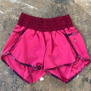 Womens Lululemon tracker shorts, pink floral trim